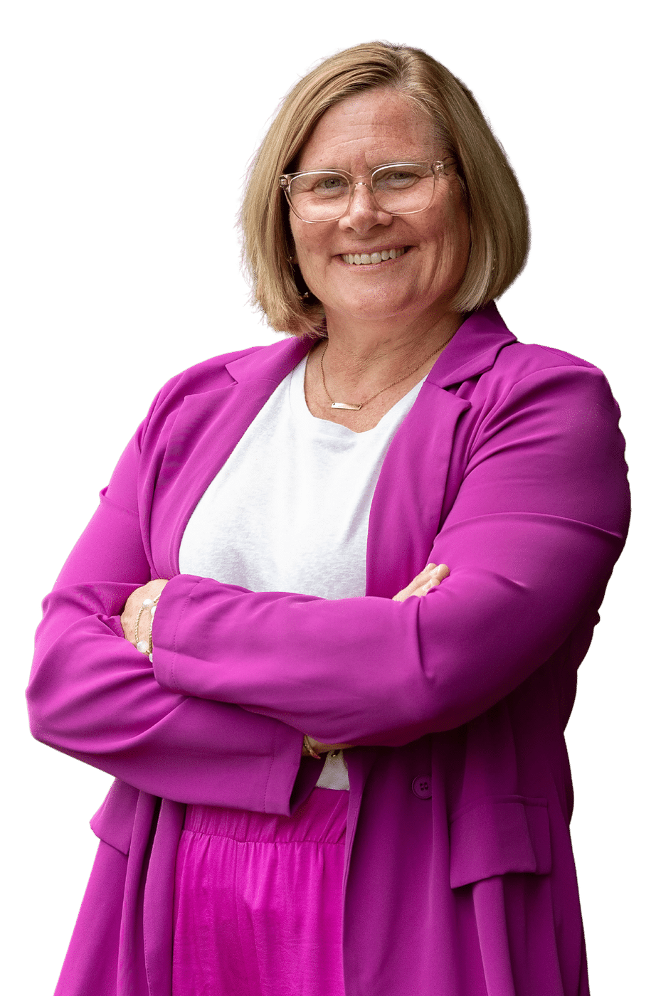 Jen Brooks, CMAA, Founder of the Global Community of Women in High School Sports, smiling with her arms folded.